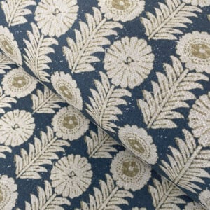 A folk-inspired block print style design with a stylised floral motif in indigo blue. A versatile mid scale design printed suitable for curtains and blinds.