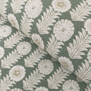 A folk-inspired block print style design with a stylised floral motif in green. A versatile mid scale design suitable for curtains and blinds.