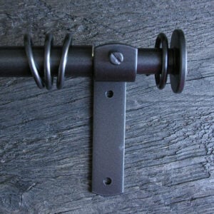 a slim dark metal curtain pole