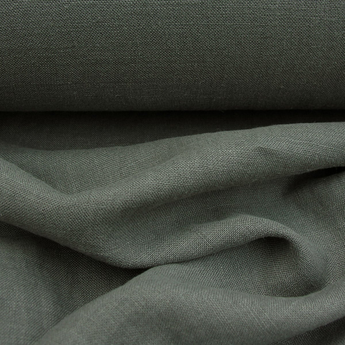 100% Linen fabric with a super soft drape in a soft dark olive green. Suitable for curtains and blinds where a good drape is uppermost.