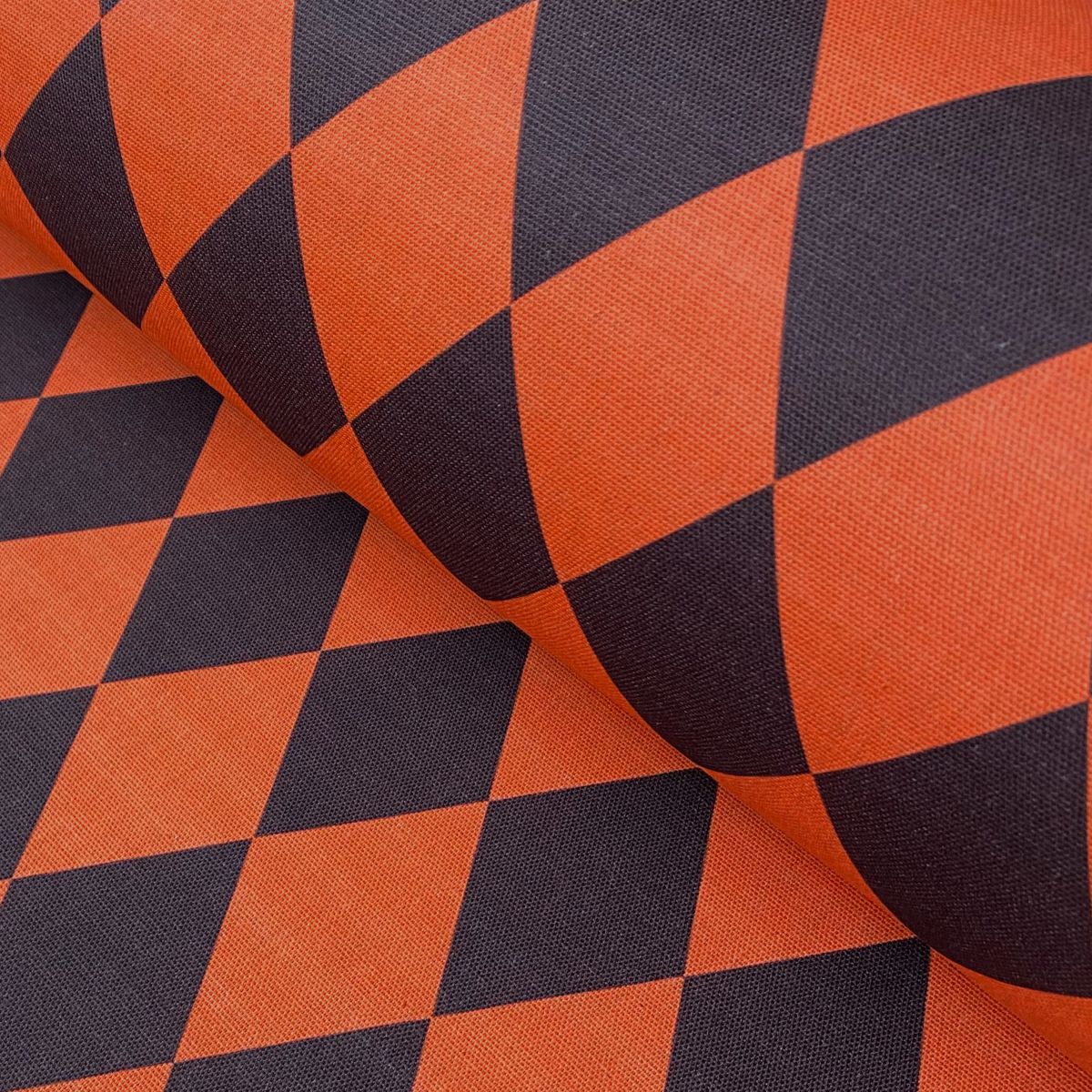 Harlequin pattern fabric in orange and brown like a cinnabar moth
