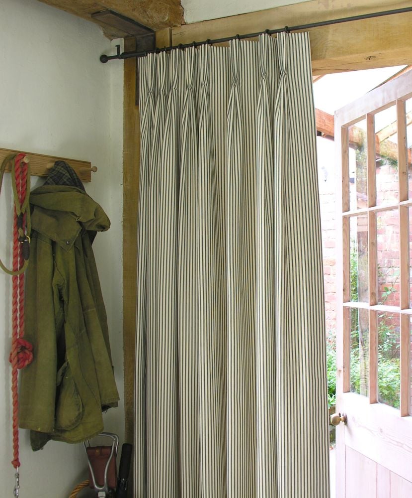 ticking fabric curtain with a triple pleat heading
