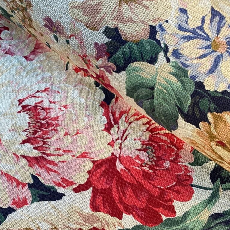 Tinsmiths Extra Wide Grandiflora fabric on a roll in red, blue & gold.