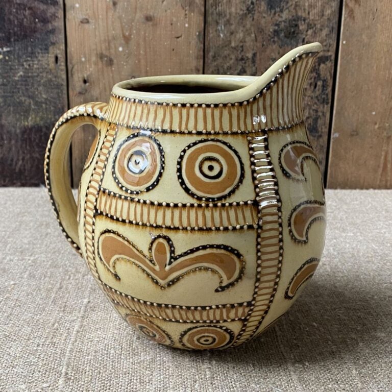 Carole Glover Slipware Noggin Jug against wooden background