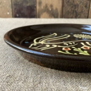 Ceramic slipware plate with a hare design by Paul Young