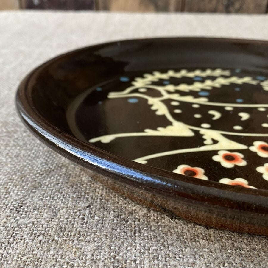 Ceramic slipware plate with a STAG design by Paul Young