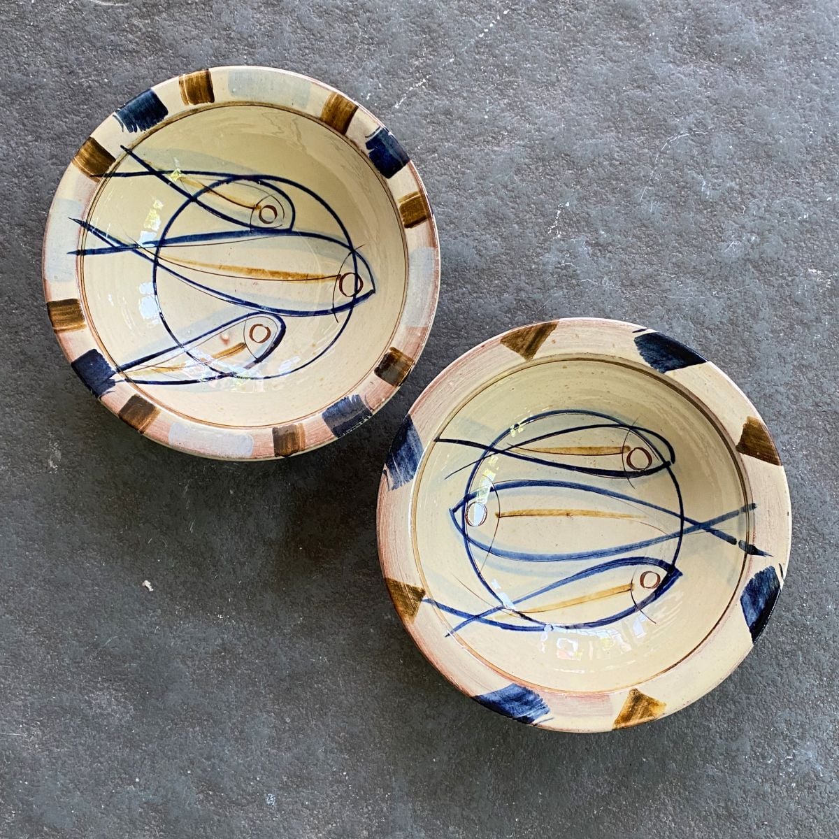 Jennifer Hall Slipware pasta bowls from above on a stone background