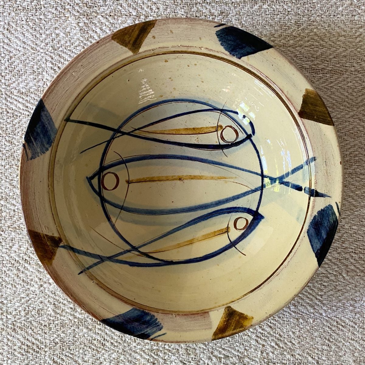 Jennifer Hall Slipware pasta bowl from above on a cream textile background