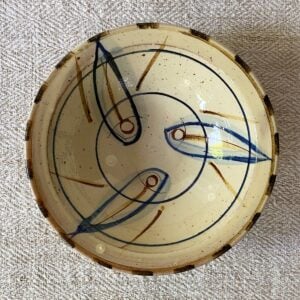 Jennifer Hall Slipware pasta bowl from above on a cream textile background