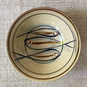 Jennifer Hall Slipware pasta bowl from above on a cream textile background