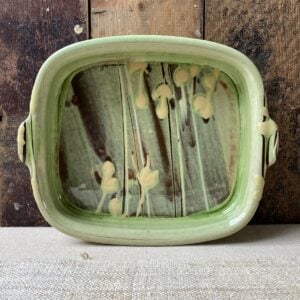 Patia Davis green glazed rectangular baking dish with wooden background