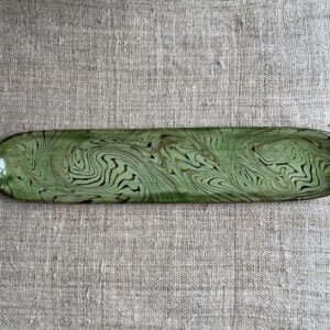 Patia Davis extra long oval platter with green glaze on linen backcloth