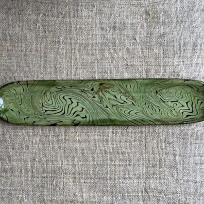 Patia Davis extra long oval platter with green glaze on linen backcloth