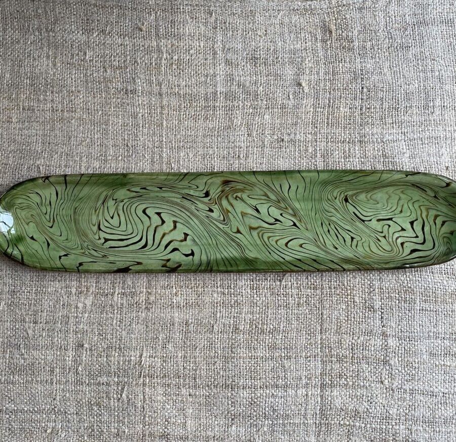 Patia Davis extra long oval platter with green glaze on linen backcloth