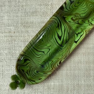 Patia Davis extra long oval platter with green glaze on linen backcloth