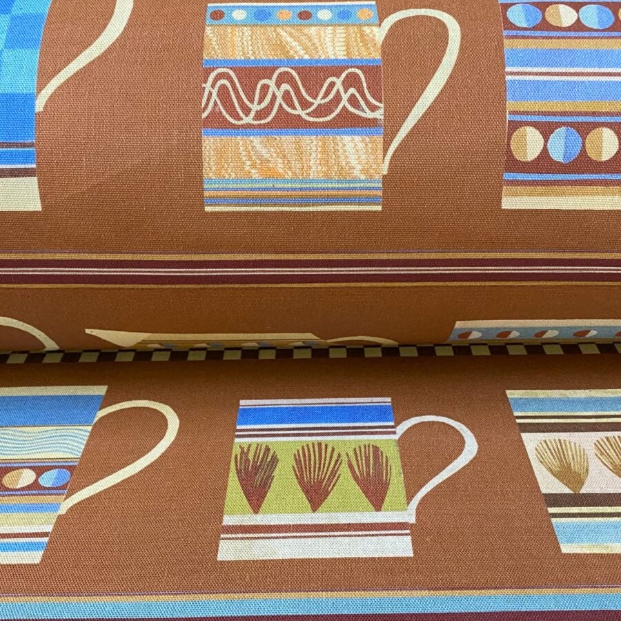 Marion Elliot design Mochaware fabric with brick background