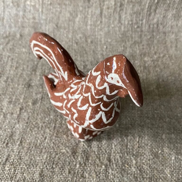 Emma Carlow Upright Cockerel clay whistle on cloth background