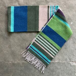 Wallace + Sewell striped wool scarf on a stone floor