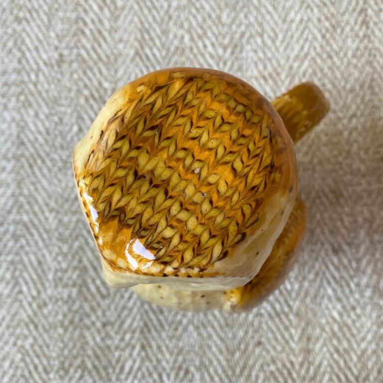Pottery jug in shape of an ow, with a removable head
