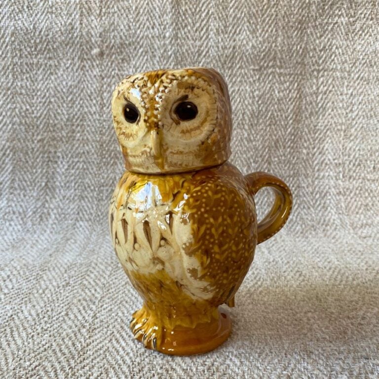 Pottery jug in shape of an ow, with a removable head