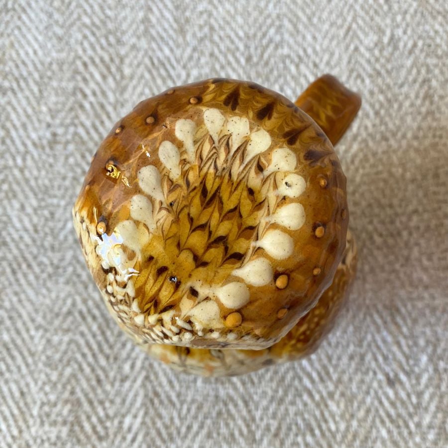 Pottery jug in shape of an ow, with a removable head