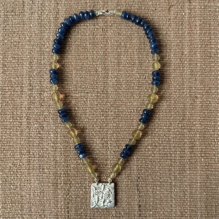 Silver Hawk necklace with blue and amber beads