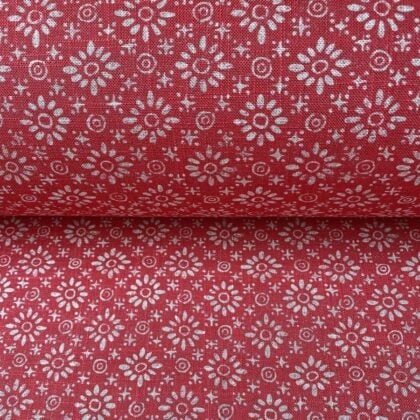 Roll of fabric with a fuschia pink floral design