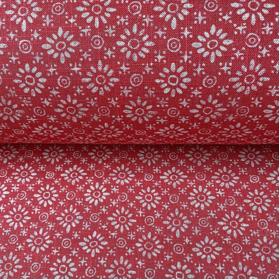 Roll of fabric with a fuschia pink floral design