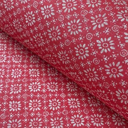 Roll of fabric with a fuschia pink floral design