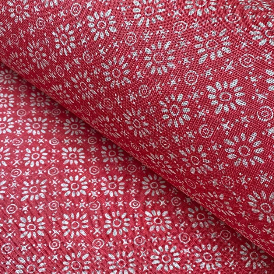 Roll of fabric with a fuschia pink floral design