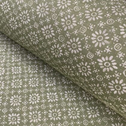 Fabric roll with green, small scale daisy pattern
