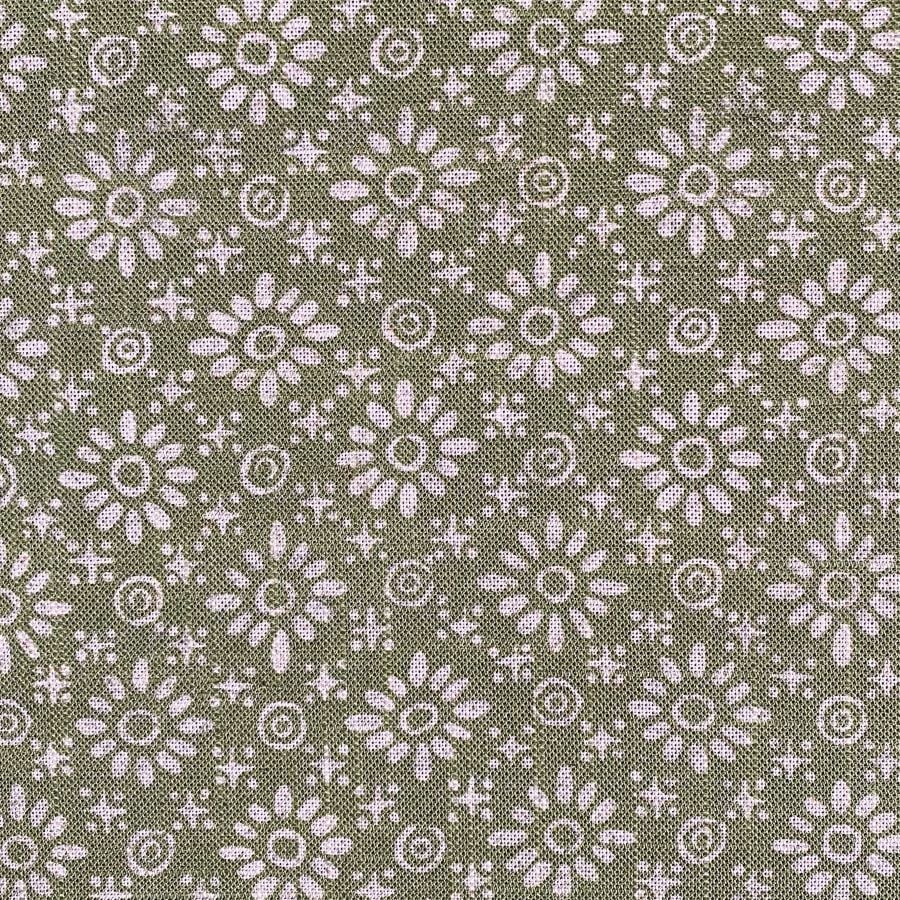 Fabric roll with green, small scale daisy pattern